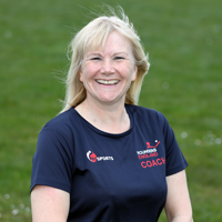 Image of Melissa Mumford, rounders coach in a rounders england tshirt. 